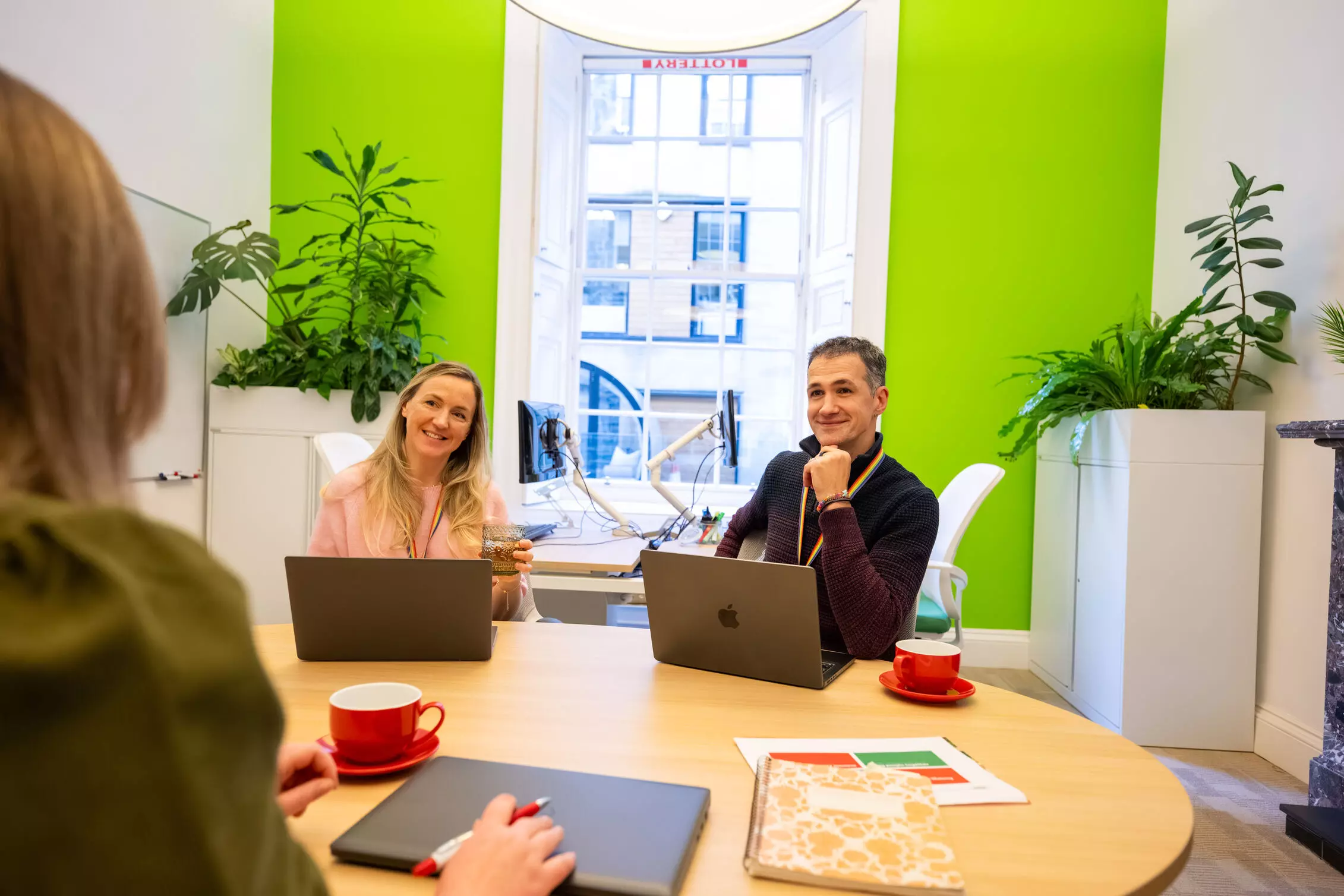 Employees having a meeting in a meeting room