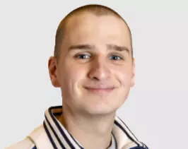 Employee working at their desk wearing headphones